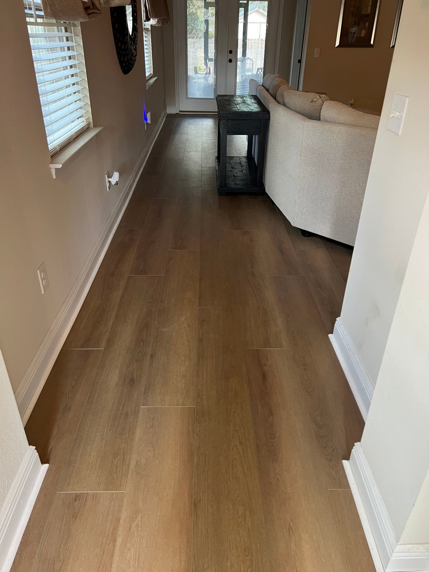 Waterproof vinyl plank flooring in home entryway featuring durable scratch-resistant luxury vinyl with natural wood grain pattern